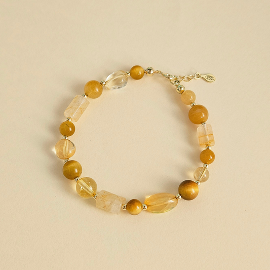 Pulseira Ilha do Sol – Citrino, Olho de tigre, Quartzo hematoide e Prata dourada